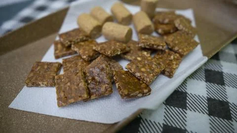 Peanuts in the shape of sweets, pacoca, cornmeal cake and peanut butter on bread Stock Photos