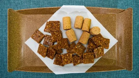 Peanuts in the shape of sweets, pacoca, cornmeal cake and peanut butter on bread Foto stock