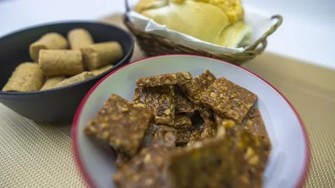 Peanuts in the shape of sweets, paçoca, cornmeal cake and peanut butter on bre Stock-Fotos