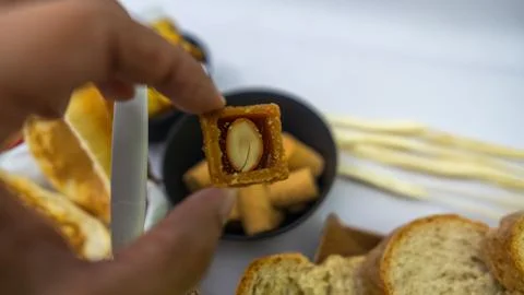Peanuts in the shape of sweets, paçoca, cornmeal cake and peanut butter on bre Foto stock