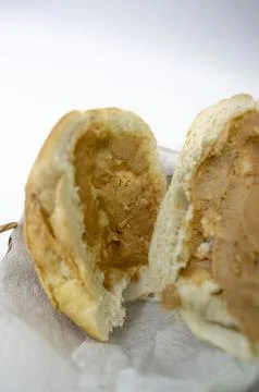 Peanuts in the shape of sweets, paoca, cornmeal cake and peanut butter on bre Foto stock