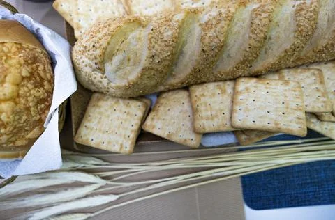 Peanuts in the shape of sweets, paoca, cornmeal cake and peanut butter on bre Stock Photos