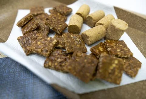 Peanuts in the shape of sweets, paoca, cornmeal cake and peanut butter on bre Stock-Fotos