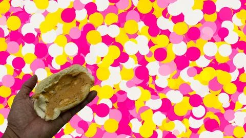 Peanuts in the shape of sweets, paoca, cornmeal cake and peanut butter on br- Stock Photos