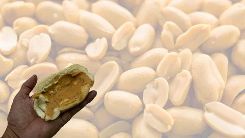 Peanuts in the shape of sweets, paoca, cornmeal cake and peanut butter on br- Stock-Fotos