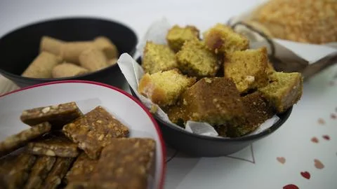 Peanuts in the shape of sweets, paoca, cornmeal cake and peanut butter on - Stock Photos