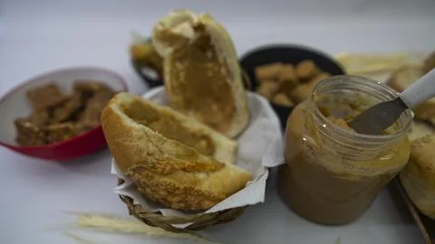 Peanuts in the shape of sweets, paoca, cornmeal cake and peanut butter on - Stock Photos