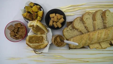 Peanuts in the shape of sweets, paoca, cornmeal cake and peanut butter on - Stock Photos