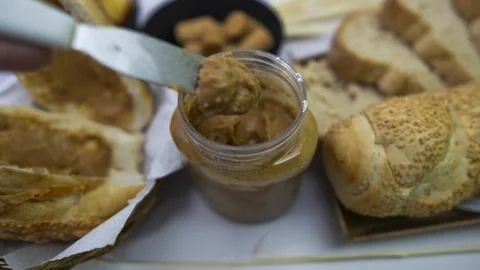 Peanuts in the shape of sweets, paoca, cornmeal cake and peanut butter on - Stock Photos