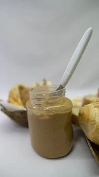 Peanuts in the shape of sweets, paoca, cornmeal cake and peanut butter on -- Stock Photos