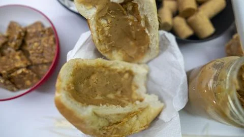 Peanuts in the shape of sweets, paoca, cornmeal cake and peanut butter on -- Stock Photos