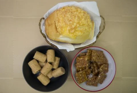 Peanuts in the shape of sweets, paoca, cornmeal cake and peanut butter on -- Stock Photos
