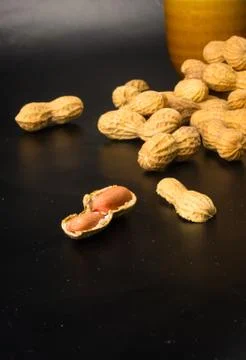 Peanuts in shell on dark background, close up Foto stock