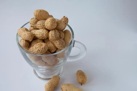 Peanuts in a shell in a glass cup Stock Photos