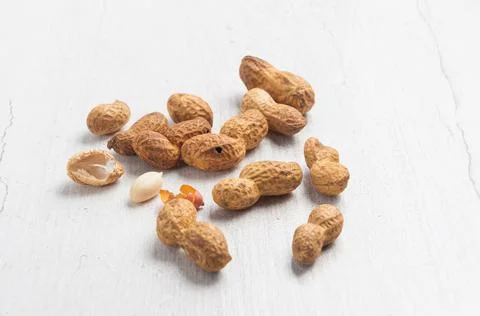 Peanuts in a shell on a light background Stock Photos