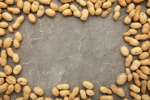 Peanuts in shells on grey background with copy space Stock Photos