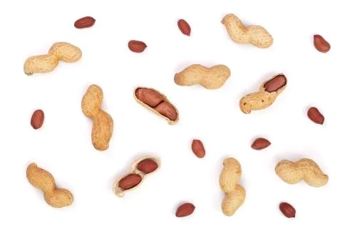 Peanuts with shells isolated on white background, top view. Flat lay pattern Stock Photos