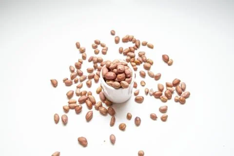 Peanuts in small cups isolated on white background Stock Photos