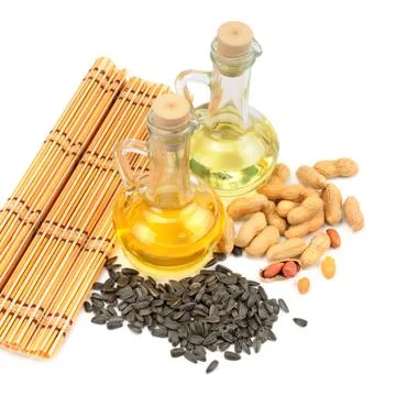 Peanuts, sunflower seeds and oils isolated on white background. 스톡 사진