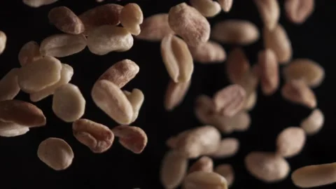 Peanuts in super slow motion on a black background Stock Footage 163151544