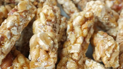 Peanuts sweet candy on table Stock Footage 240796910