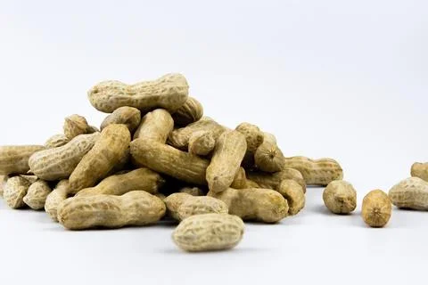 Peanuts top view on white background. Stock Photos