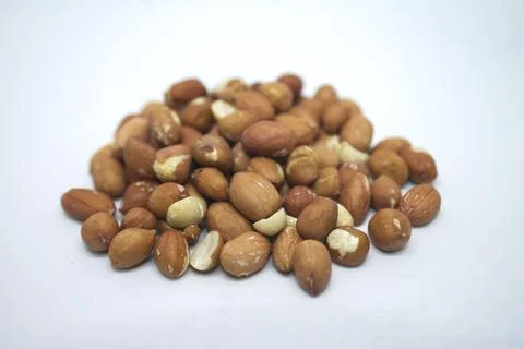 Peanuts on white background closeup image Stock Photos