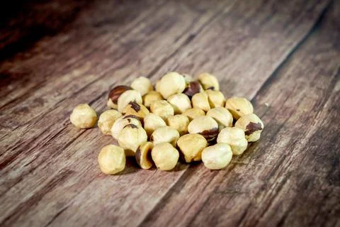 Peanuts on wooden background, composition of nuts, food background Stock Photos