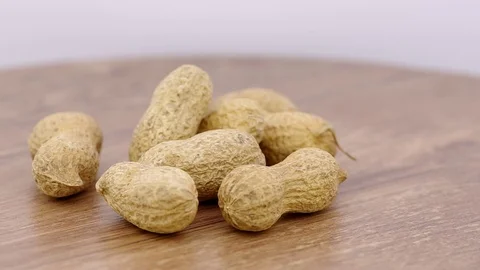 Peanuts on a wooden background Stock Footage 123860946