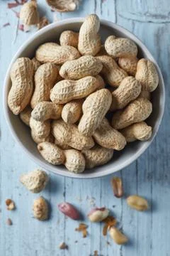 Peanuts on wooden background Stock Photos
