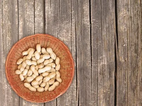 Peanuts On The Wooden Background Stock Photos