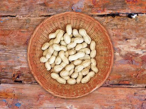 Peanuts On The Wooden Background Stock Photos