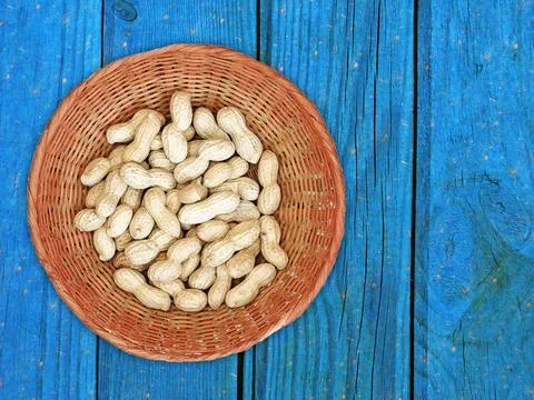 Peanuts On The Wooden Background Stock Photos