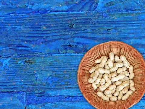 Peanuts On The Wooden Background Stock Photos