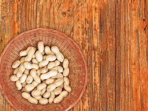 Peanuts On The Wooden Background Stock Photos