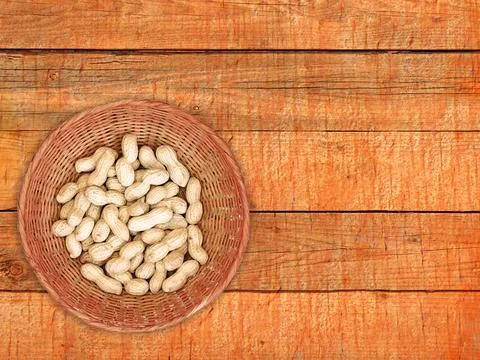 Peanuts On The Wooden Background Stock Photos