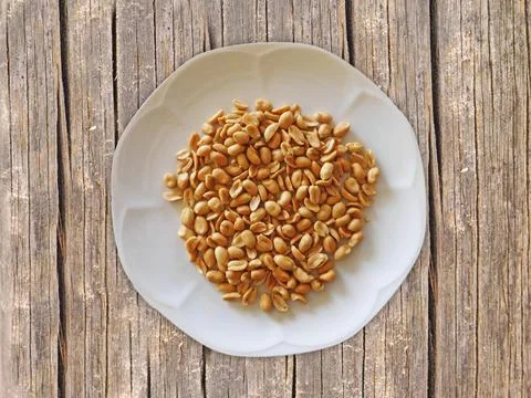 Peanuts On Wooden Background Stock Photos