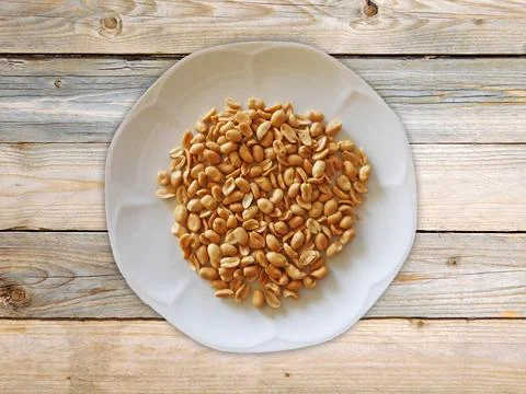 Peanuts On Wooden Background Stock Photos