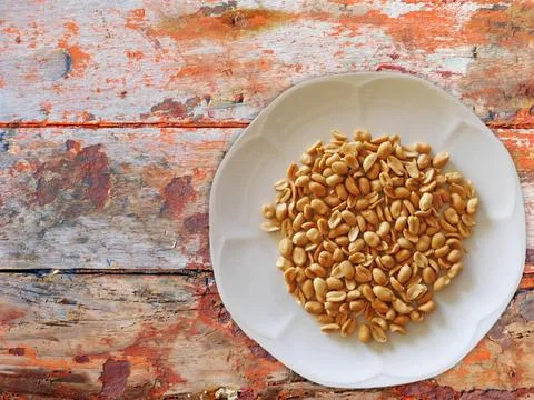 Peanuts On Wooden Background Stock Photos