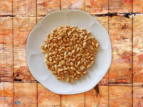 Peanuts On Wooden Background Stock Photos