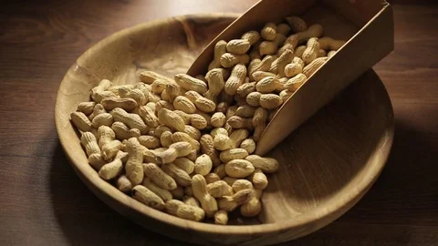 Peanuts on wooden dish Stock Footage 74731732