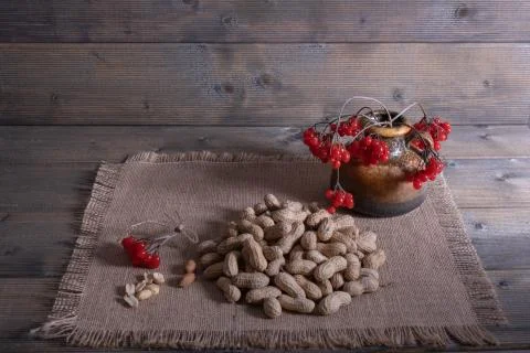 Peanuts on a wooden table. Stock Photos