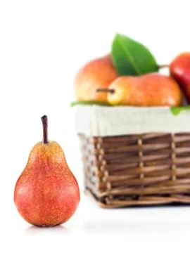 Pear with a basket in the background Stock Photos