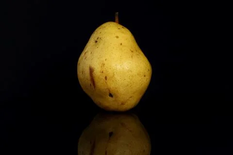 Pear on a black background with reflection Stock Photos