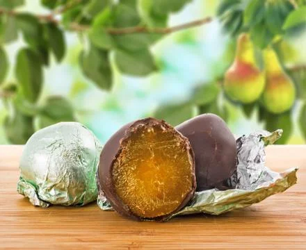 Pear in chocolate Stock Photos