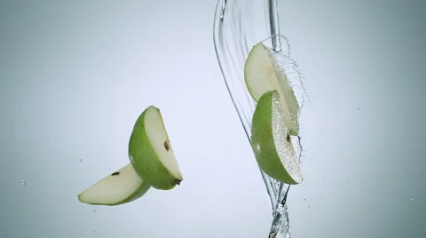 Pear colliding against water stream. Slow Motion. Stock Footage 56697506