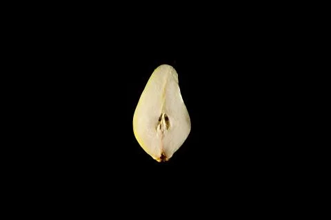 Pear cut in half, one light source, on black background Stock Photos
