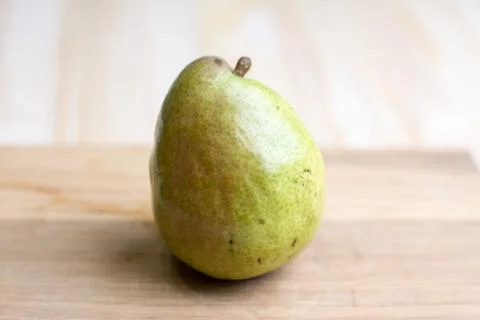 Pear on cutting board Stock Photos