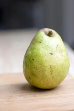 Pear on cutting board Stock Photos