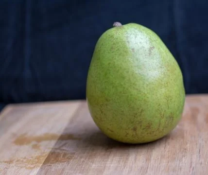 Pear on cutting board Stock Photos